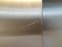 I'm trying to fix a repair gone awry. Stainless Steel Lift Door Scratch Removal Bespoke Repairs