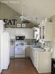 Rustic farmhouse decor above kitchen cabinets. Love The Above Cabinets And Thick Plank On Top Of Cabinets Instead Of Crown Moulding Kitchen Cabinets Decor New Kitchen Cabinets Above Kitchen Cabinets