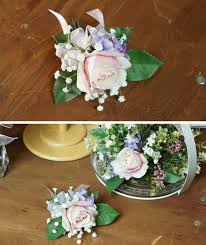 Boutonnieres are small floral arrangements worn on jacket lapels during formal events, such as a you can buy boutonnieres from local florists, but you can make your own with a few simple next, stick a piece of floral wire through the base of the flower and fold it in half downward to make a fake. How To Make Your Own Silk Flower Boutonniere Christmas Central