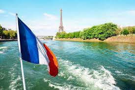 All the practical information you need for your visit to the eiffel tower: France Paris French Flag Flying Over The Seine With Eiffel Tower In The Background Stockphoto