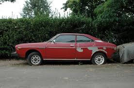 Image result for Herald Yellow 1976 Subaru