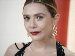 Elizabeth Olsens Liquid-Look Givenchy Gown Is Stunning From All Angles |  Glamour