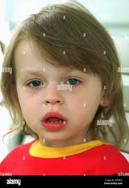 Amanda Sikora, 3, sits