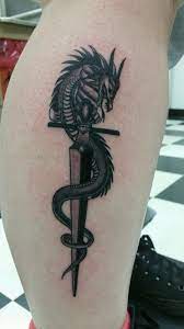 American traditional dragon tattoo ideas. Forearm Dragon Dagger Tattoo Novocom Top