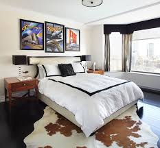 Masculine Bedroom With Cowhide Rug White And Black Bedspread And Black Accents Lux Design Cheap Bedroom Decor Small Apartment Furniture Modern Bedroom
