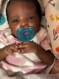 The 3-month-old daughter of Ruben Santiago and Caitlin Gibson died of  blunt-force head trauma and had seven fractured ribs and a fractured wrist.