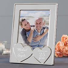 The silver keychain touches on the traditional 25th anniversary gift and includes a 25 cent coin in the year you were married. 25th Anniversary Gifts Silver Anniversary Gifts