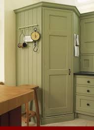 The Benefits Of Honey Oak Cabinets With Black Stainless Steel Appliances Oakkitchencabinets Kit Green Kitchen Cabinets Green Cabinets Green Kitchen Walls