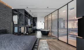 I like the wooden bed and side table that sits on top a soft carpet that brings a contrast of texture to the space. A Modern Bachelor Pad With Smart Glass Space Dividers