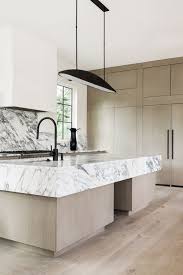 These stunning kitchens are full of farmhouse inspiration! Currently Inspired By White Marble Kitchen Island White Marble Kitchen Marble Kitchen Island