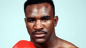 Who wins a trilogy of fights between '90 Evander Holyfield and '73 Ken  Norton?