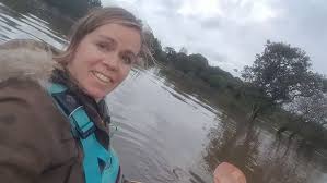 Farmers use kayak to rescue cows stranded in shoulder-deep flood water