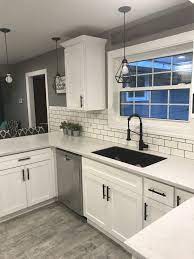 White Shaker Cabinets With Solid Surface Countertops And Flat Black Handles Kitchen Room Design White Kitchen Design Kitchen Design