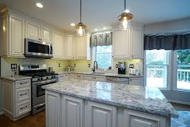 Modern Touches Were Added With The Porcelain Subway Tile Backsplash And Sleek Edges On The Brown Fantasy Grani Kitchen Remodel Newly Remodeled Kitchens Kitchen