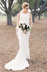 The trumpet wedding dress is a flattering silhouette that can be both traditional and sexy. Bateau Neckline Ivory Satin Mermaid Wedding Dress Promfy