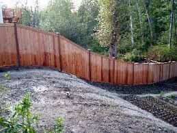 Wood fence on a hill. 15 Fence On A Slope Ideas Fence Backyard Fences Fence Design