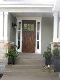 Front Door Like How Its A Grey House And White Trim And Real Wood Door Looks Great With House Exterior House Paint Exterior Exterior Paint Colors For House