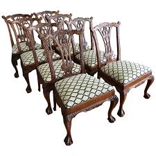 Blue zebra print dining chairs surround an oval glass top dining table in an elegant french dining room clad in hand painted wallpaper. Set Of 10 Chippendale Dining Chairs 5 For Sale On 1stdibs