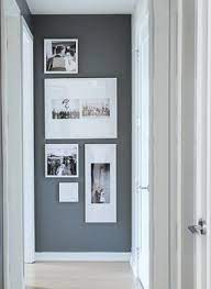 The sconces and gallery wall make a huge impact! Interior Design Ideas Window Treatments Remodeling Fabrics Greensboro High Point Nc End Of Hallway Photo Wall Collage Living Room Home Decor