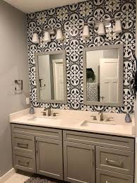 Penny round tiles are used as for floor as to create an accent on the shower's wall ( braswell design+build) blue arabesque tiles for the shower zone. Master Bathroom Reveal Bathroom Wall Tile Bathroom Accent Wall Bathroom Accents