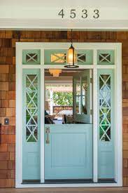 Slate pavers finish the front covered door design on a white house with white siding and a blue front door. Spring Home Makeover Front Porch Edition Hirshfield S