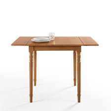 Its durable top is made of solid mango wood and set on an architectural metal base. A Drop Leaf Dining Table Will Transform Your Cramped Apartment Architectural Digest