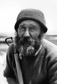 Shoveling clam shells ~ circa 1905 ~ Photo by Oscar Grossheim of men  shoveling clam shells into wheelbarrows, possibly