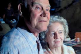 A security officer inside the elevator. John Forsythe, Peter Mark Richman,  and Lance LeGault.