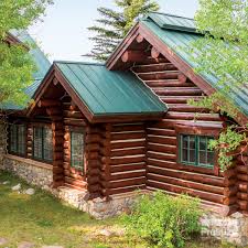 logs stone and corruguated metal roofing complement each