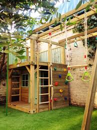 A Small Structure With A Climbing Wall Hanging Swing And A Little House Like Interior Children Coul Backyard Play Outdoor Kids Play Area Backyard Playground