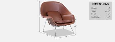 The reclining chair and matching stationary ottoman are upholstered in bonded leather for top quality and lasting comfort. Danish Modern L A Eero Saarinen Womb Cognac Leather Chair With Ottoman For Knoll