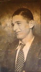 Here is a picture from 1949. My grandfather and his bike. Is someone able  to colourise and make this one clearer? With thanks, Dave.