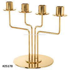 Clear glass hurricane lamp candle holders on aluminum round pedestal bases with contoured aluminum stems. Solid Brass Four In One Large Pillar Candle Stands Buy Solid Brass Four In One Large Pillar Candle Stands Four Light Metal Candle Stand New Decorative Candle Stand Product On Alibaba Com