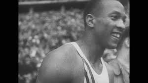 1940s: Jesse Owens and Ralph Metcalfe winning race, athletes competing in  high