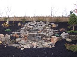 Not Sure What To Do With A Sloping Backyard Add A Pond Less Waterfall Created By Bristol S Garden Center Victor Ny Backyard Sloped Garden Ponds Backyard