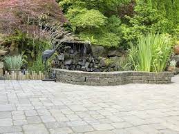 This circular paver patio combines natural stone pavers with a mulch border. The 10 Best Patio Design Ideas Lovethegarden