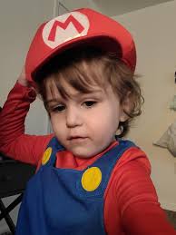 My toddler in his halloween costume. He wanted to bring his Yoshi along. He  has autism and is obsessed with Mario. : r/Mario