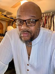 Sophisticated edge 🌊 Teal shirt with light grey trousers and brown  sneakers — bold yet refined.