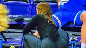 UCLA Trainer Who Went Viral for Her Provocative Courtside Pose Has Been Identified & Locks Down Social Media [PHOTOS]