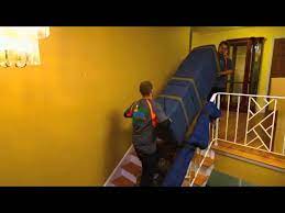 How to get large pieces of furniture up stairs. How To Move A Large Piece Of Furniture On Stairs Monster Movers Youtube