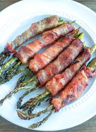 Bacon Wrapped Asparagus On A White Plate Bacon Wrapped Asparagus Bacon Wrapped Romantic Dinner Recipes