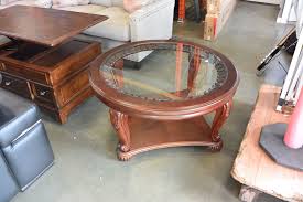Includes coffee table and 4 upholstered stools. New Ashley Round Carved Mahogany Glass Top Coffee Table Retail 599