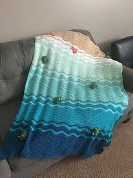 This pattern was originally published in 2015, but since then it has been updated a couple of times and was also featured in a magazine! Welcome To The Beach Beach Themed Crochet Throw Measures Approx 56 X 38 Color Of Blanket Is Shown In Photos Beach Themed Room Crochet Throw Crochet Turtle