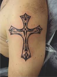 Celtic cross tattoos carried on him arm with fine white detailed knot work. 150 Best Cross Tattoos For Men 2020