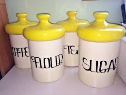 Store items and add a decorative touch with these kitchen canisters. Vintage Set Of 4 Holiday Designs Primary Yellow Kitchen Canisters Mushroom Lids Kitchen Canisters Yellow Kitchen Canisters Yellow Kitchen