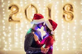 Check spelling or type a new query. Young Romantic Couple In Santa Claus Hats Is Waiting For Christmas Stock Photo Picture And Royalty Free Image Image 90697127