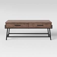 You can eat dinner on it, paint your nails, store your latest and since a large vintage drum isn't necessarily something you can swing over to your nearest target and pick up, keep your eye out at garage sales. Corinna Angle Leg Coffee Table Wood Threshold Target