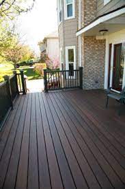 The most common color choices include both dark greys and dark mocha browns. Found On Bing From Www Pinterest Com Deck Paint Deck Paint Colors Staining Deck