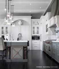 A modern kitchen island in chrome or painted in a deeper or contrasting colour to the wall cabinets will make it a focal point in a grey kitchen. These 15 Grey And White Kitchens Will Have You Swooning