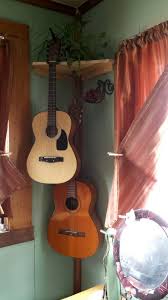 First, print a picture of the outline of a guitar pick in microsoft excel (this will allow you to print the picture across multiple pieces of paper). Corner Shelf With Guitar Holders Diy House Projects Guitar Hanger First Apartment Decorating